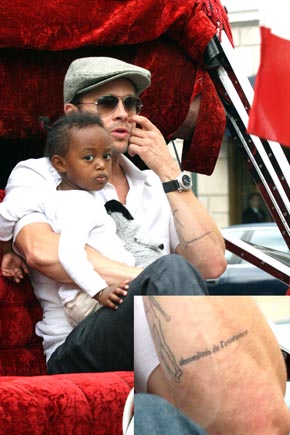 On their website , Us Weekly has a story about Brad Pitt's tattoo (he's 